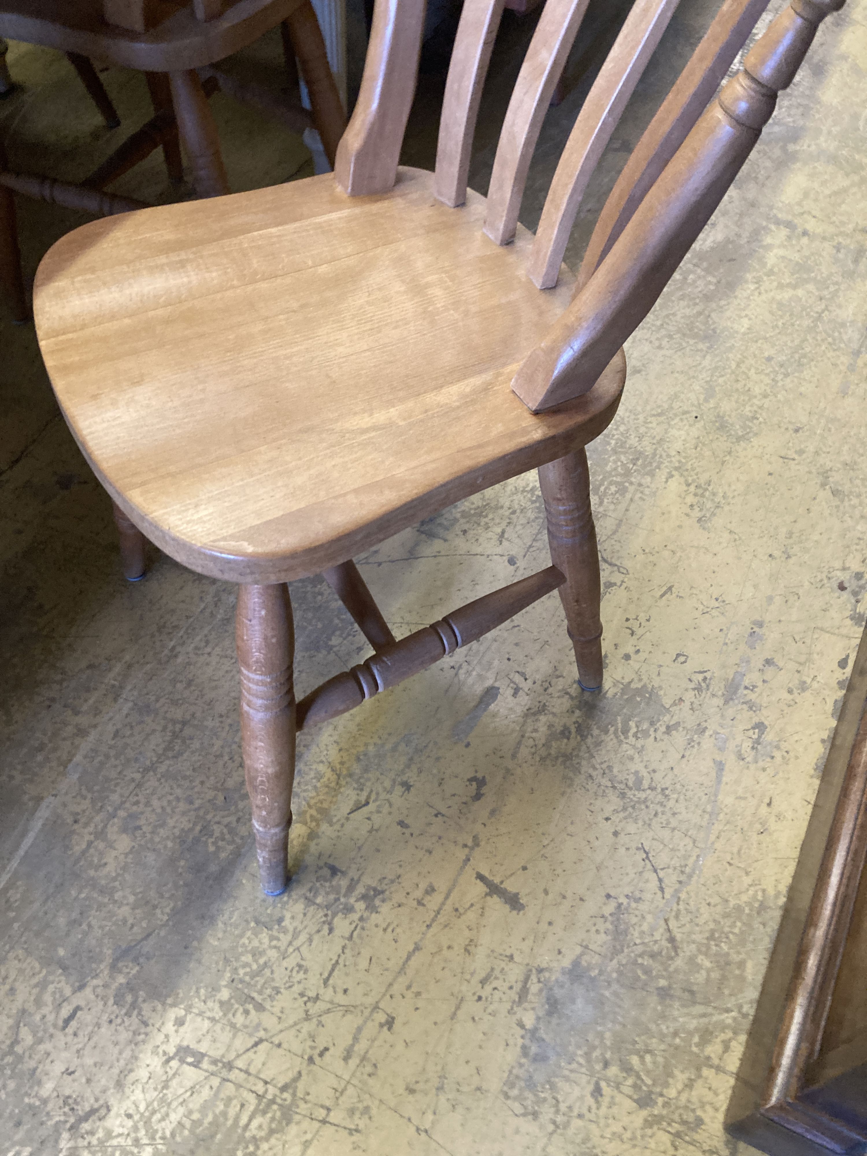 A Victorian style rectangular painted pine kitchen table, length 150cm, depth 90cm, height 79cm and four Windsor beech lathe back kitch